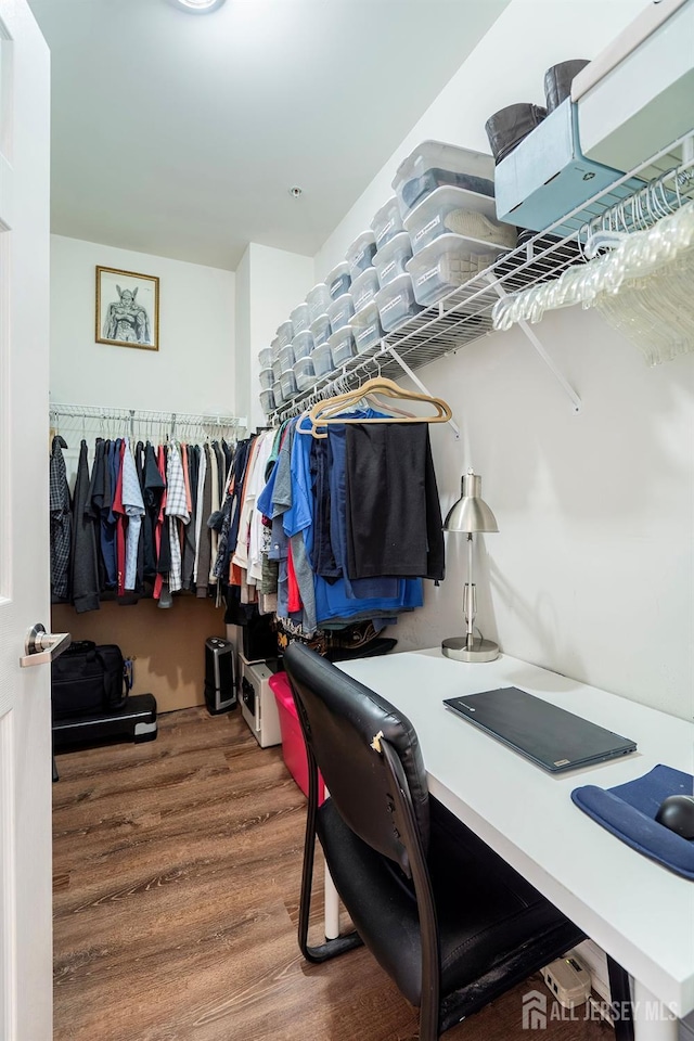 spacious closet with wood finished floors