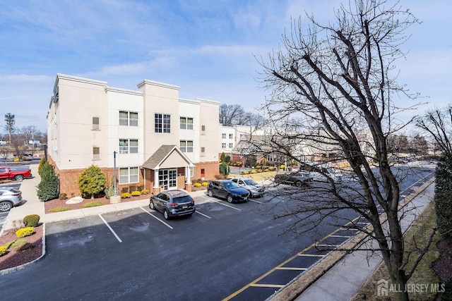 view of property with uncovered parking