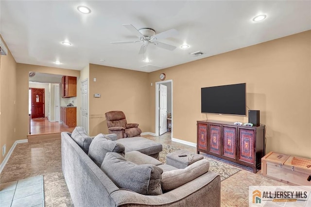 living area featuring a ceiling fan, recessed lighting, visible vents, and baseboards