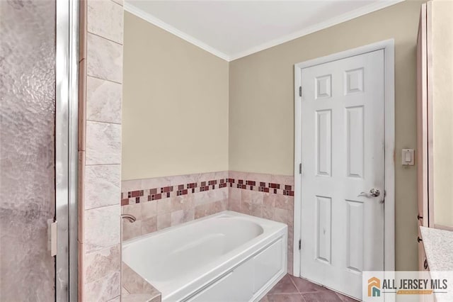 full bathroom with a garden tub, tile patterned flooring, and ornamental molding