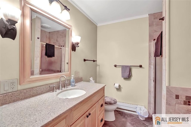 bathroom featuring toilet, vanity, baseboard heating, an enclosed shower, and crown molding