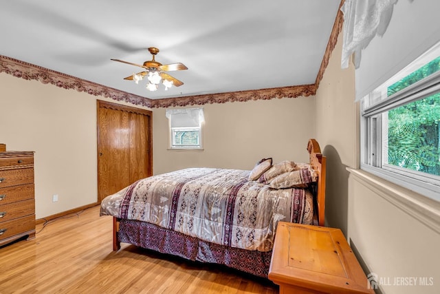 bedroom featuring light wood-type flooring and ceiling fan