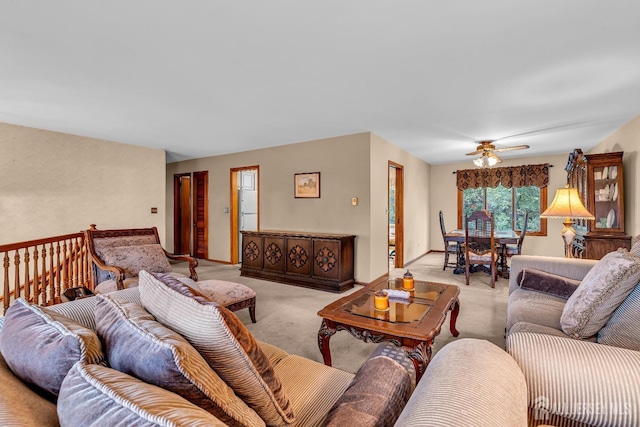 living room with light carpet and ceiling fan