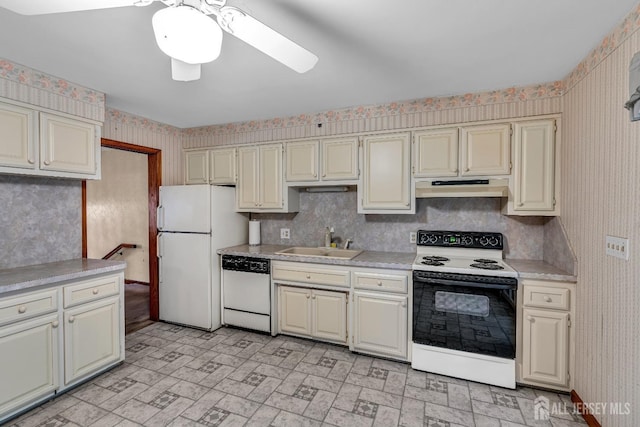 kitchen with ceiling fan, sink, white appliances, and cream cabinetry