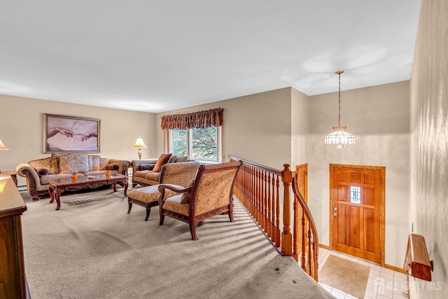 living room with light carpet and a chandelier