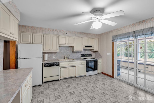 kitchen featuring ceiling fan, sink, a baseboard radiator, and white appliances