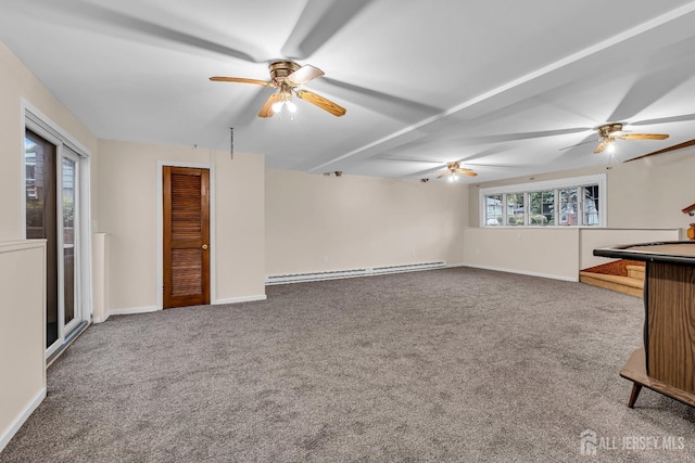 unfurnished living room with carpet, a healthy amount of sunlight, and a baseboard heating unit