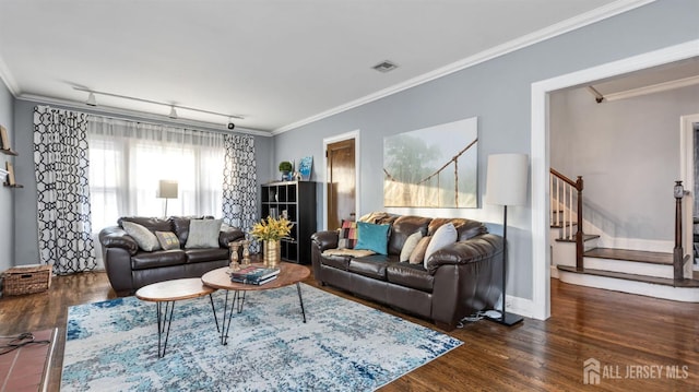 living room featuring rail lighting, stairway, wood finished floors, and crown molding