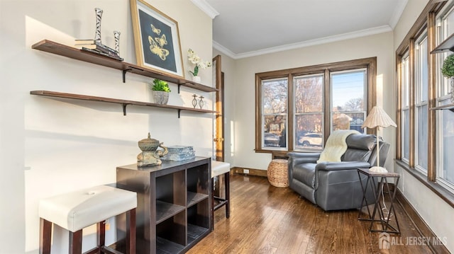 living area with dark wood-type flooring, baseboards, and ornamental molding