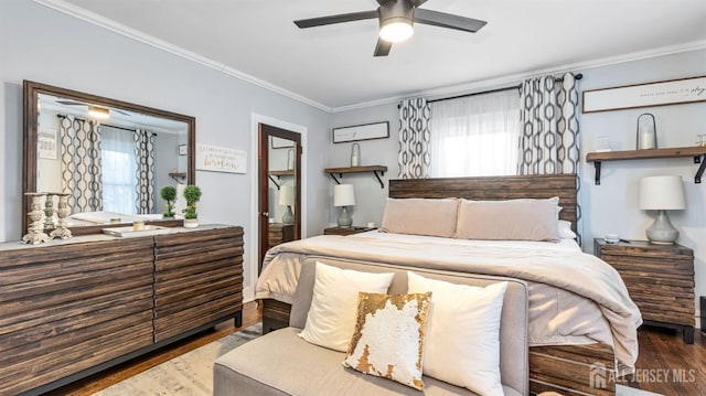 bedroom featuring a ceiling fan, wood finished floors, and crown molding