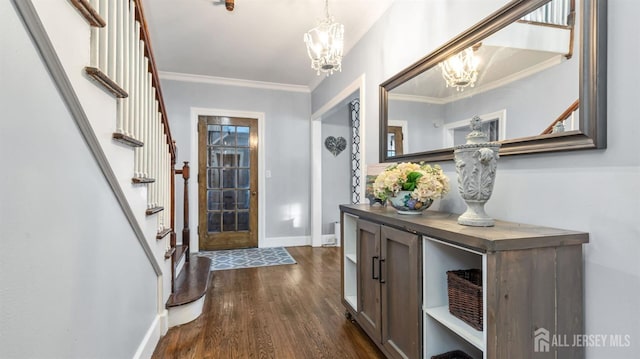 entryway featuring stairs, crown molding, a chandelier, dark wood-style flooring, and baseboards