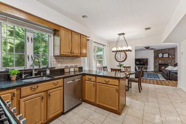 192 Middlesex Ave, Piscataway, NJ 08854 - kitchen featuring dishwasher, a ceiling fan, a stone fireplace, and light tile patterned floors