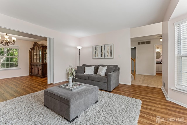 192 Middlesex Ave, Piscataway, NJ 08854 - living room with wood finished floors and a chandelier