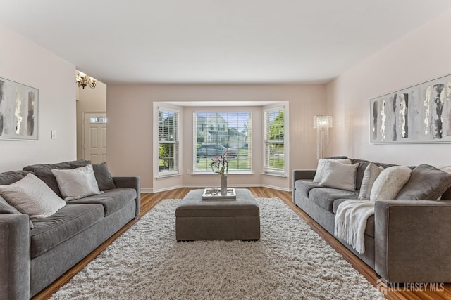 192 Middlesex Ave, Piscataway, NJ 08854 - living area with a chandelier and wood finished floors