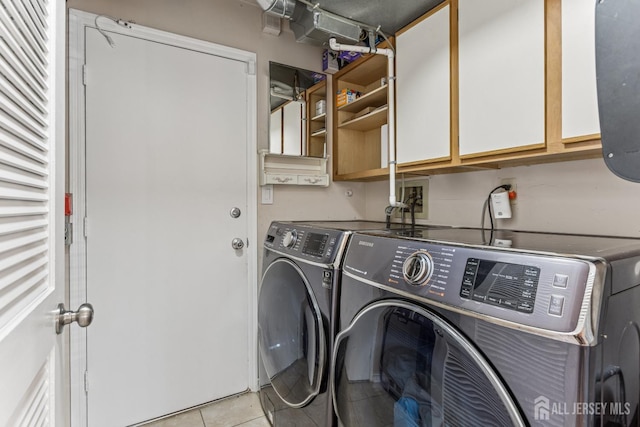 192 Middlesex Ave, Piscataway, NJ 08854 - laundry room with cabinet space, washer and dryer, and light tile patterned flooring