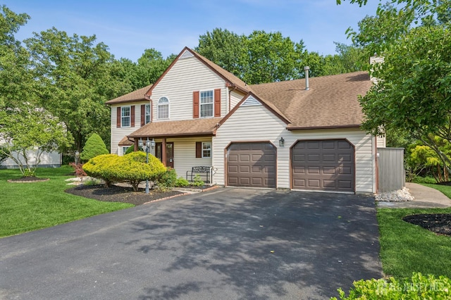 192 Middlesex Ave, Piscataway, NJ 08854 - view of front of house with a garage, driveway, a front yard, and a shingled roof