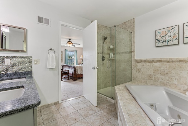 192 Middlesex Ave, Piscataway, NJ 08854 - ensuite bathroom featuring a jetted tub, double vanity, a shower stall, a ceiling fan, and tile patterned flooring