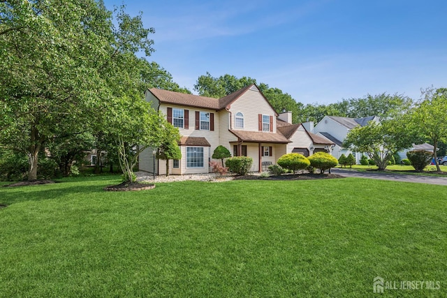 192 Middlesex Ave, Piscataway, NJ 08854 - view of front facade with a front lawn, driveway, and an attached garage