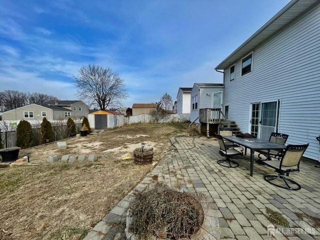 view of yard with a patio area and a storage shed