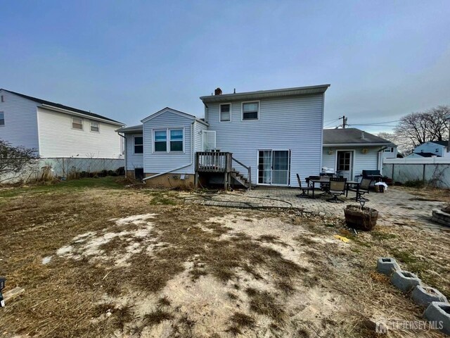 back of house with a patio