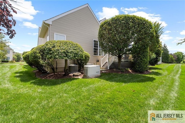 8 Tamarack Rd, Monroe, NJ 08831 - view of side of property featuring a wooden deck and a yard