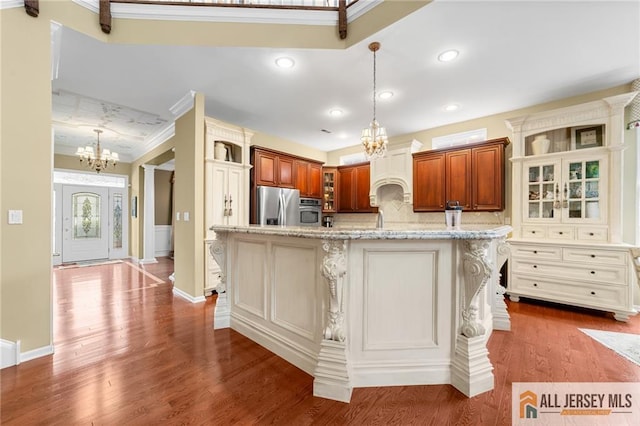 8 Tamarack Rd, Monroe, NJ 08831 - kitchen with a chandelier, stainless steel appliances, crown molding, custom range hood, and glass insert cabinets