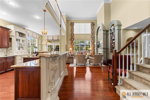 8 Tamarack Rd, Monroe, NJ 08831 - kitchen with open floor plan, ornamental molding, light stone counters, plenty of natural light, and a high ceiling