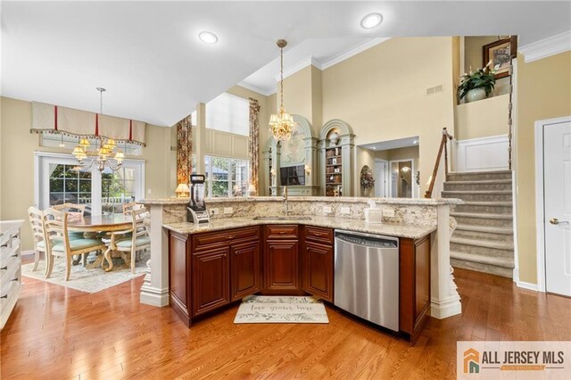 8 Tamarack Rd, Monroe, NJ 08831 - kitchen with dishwasher, a chandelier, pendant lighting, ornamental molding, and a towering ceiling