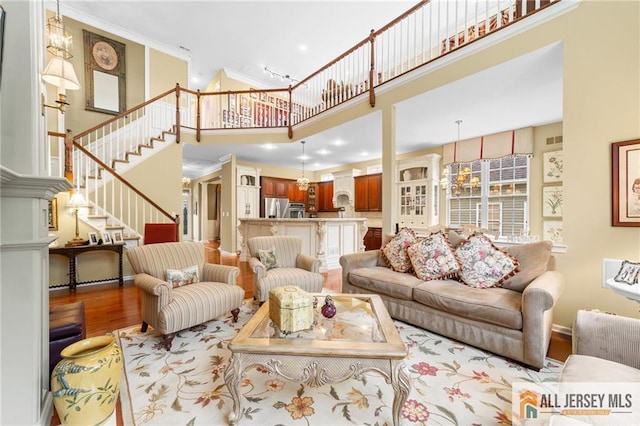 8 Tamarack Rd, Monroe, NJ 08831 - living area featuring a towering ceiling, wood finished floors, stairs, and recessed lighting