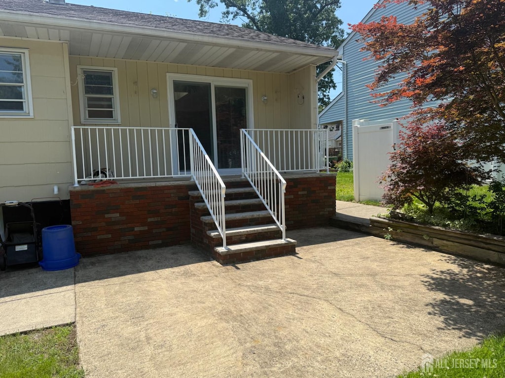 119 Burnett St, Edison, NJ 08817 - view of exterior entry with covered porch and a patio area
