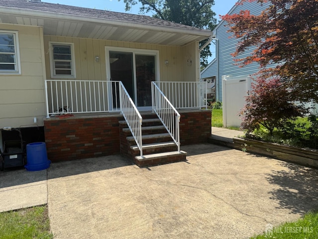 119 Burnett St, Edison, NJ 08817 - view of exterior entry with covered porch and a patio area