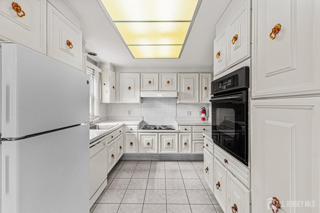 kitchen with black appliances, white cabinetry, light countertops, and a sink