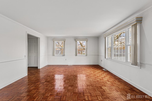 unfurnished room with baseboards