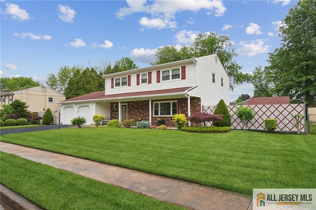 39 Evergreen Ter, Monroe, NJ 08831 - view of front of house featuring driveway, a garage, a porch, and brick siding