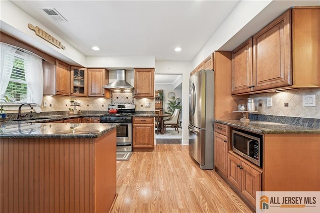 39 Evergreen Ter, Monroe, NJ 08831 - kitchen featuring stainless steel appliances, wall chimney exhaust hood, brown cabinetry, light wood finished floors, and recessed lighting