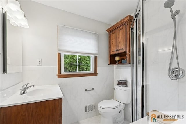 39 Evergreen Ter, Monroe, NJ 08831 - full bathroom featuring vanity, tile walls, a shower stall, and wainscoting