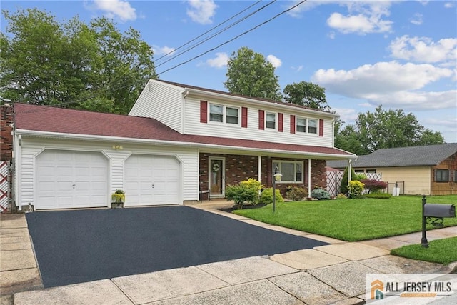39 Evergreen Ter, Monroe, NJ 08831 - traditional-style house featuring a garage, driveway, a front yard, and brick siding