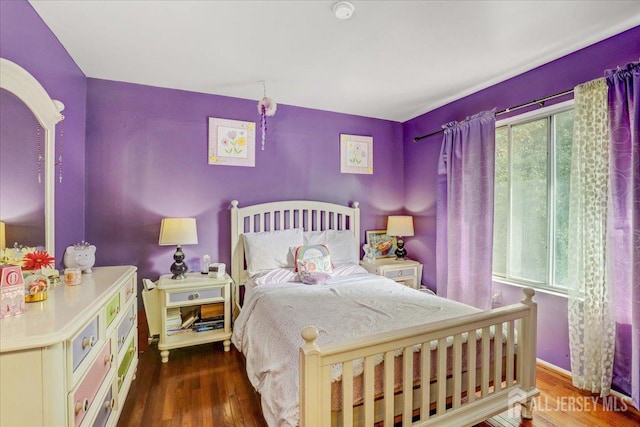 bedroom featuring dark wood-type flooring