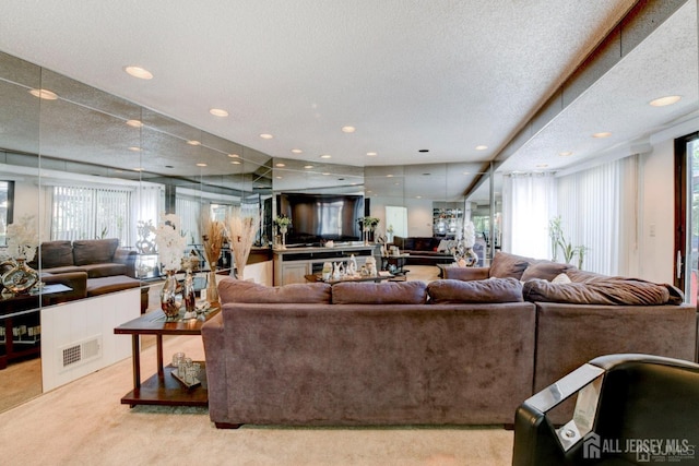 55 Smith St, Perth Amboy, NJ 08861 - carpeted living room featuring recessed lighting and a textured ceiling