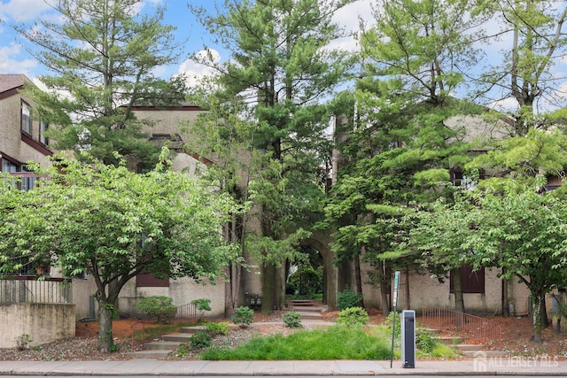 55 Smith St, Perth Amboy, NJ 08861 - view of property hidden behind natural elements