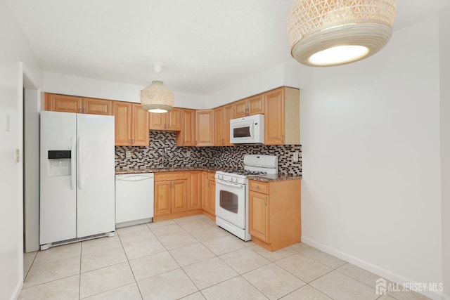 55 Smith St, Perth Amboy, NJ 08861 - kitchen featuring white appliances, backsplash, light tile patterned floors, and stone countertops