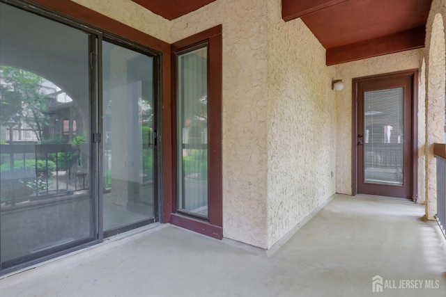 55 Smith St, Perth Amboy, NJ 08861 - property entrance with stucco siding