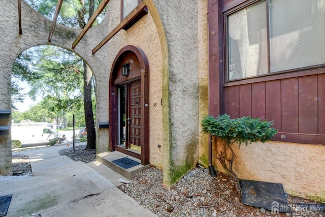 55 Smith St, Perth Amboy, NJ 08861 - property entrance with stucco siding