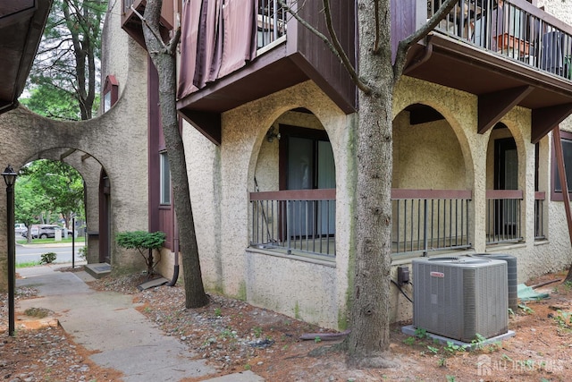 55 Smith St, Perth Amboy, NJ 08861 - view of side of property with a balcony and stucco siding
