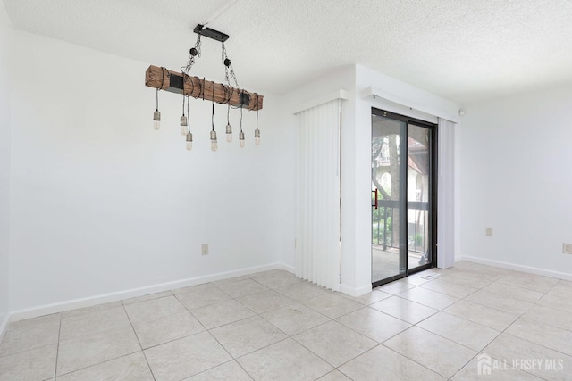 55 Smith St, Perth Amboy, NJ 08861 - unfurnished dining area featuring a textured ceiling and light tile patterned floors