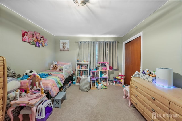 bedroom with carpet floors and a closet