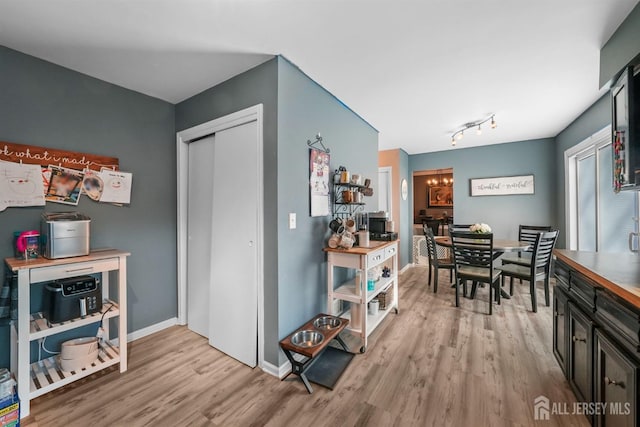 interior space featuring a notable chandelier and light hardwood / wood-style floors