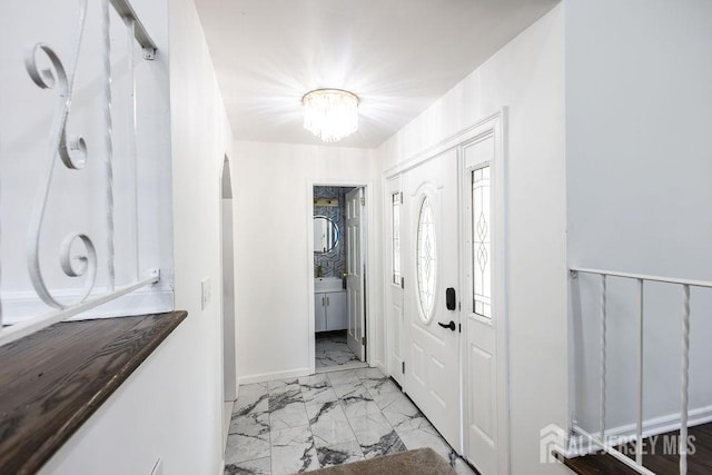 20 Wick Dr, Fords, NJ 08863 - foyer entrance with marble look tile flooring and a chandelier