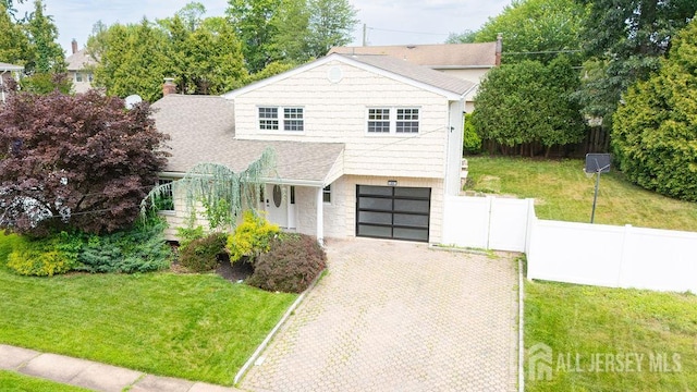 20 Wick Dr, Fords, NJ 08863 - view of front of property with a garage, decorative driveway, stone siding, and roof with shingles
