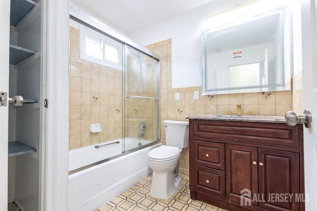 20 Wick Dr, Fords, NJ 08863 - bathroom with tile walls, vanity, and shower / bath combination with glass door